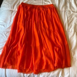 Orange flowy skirt.